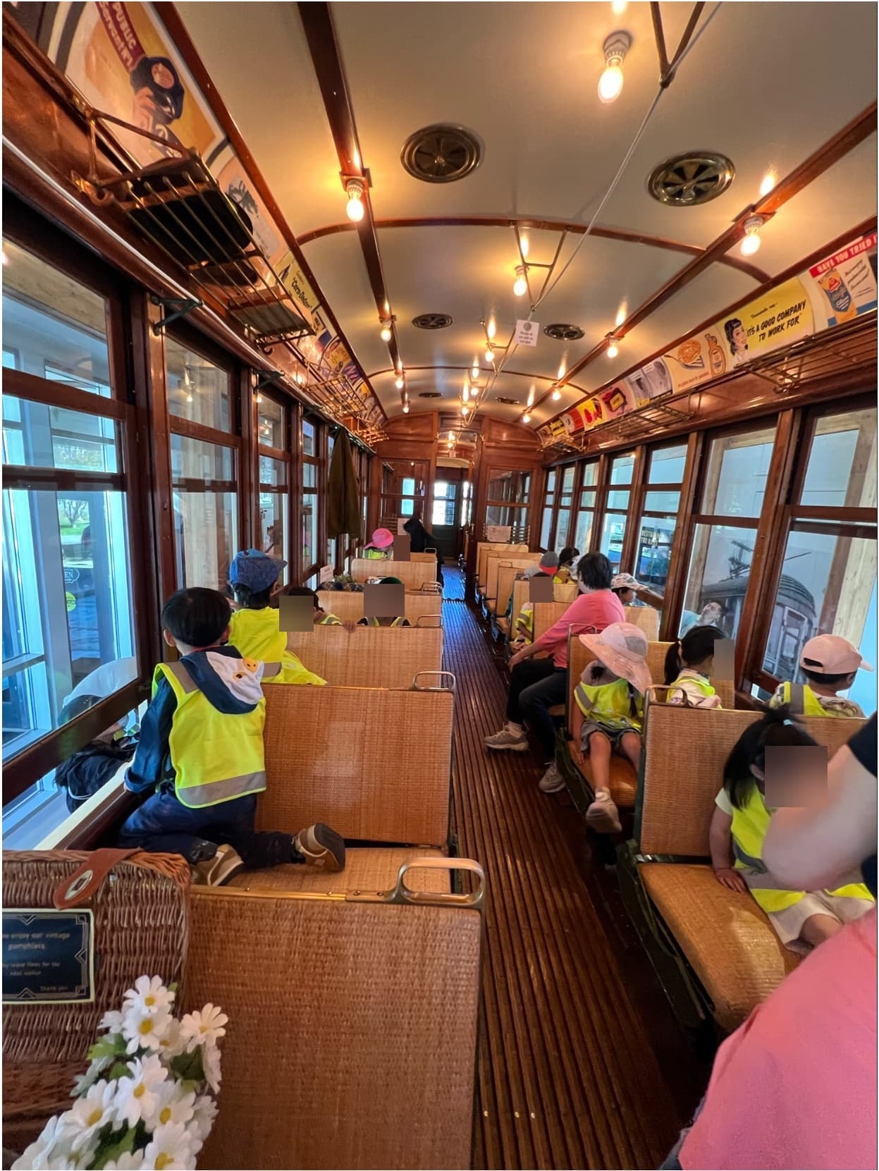 Children on a field trip riding a vintage trolley